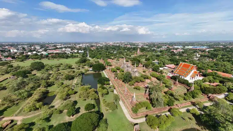 Local guide explaining an Ayutthaya temple to visitors